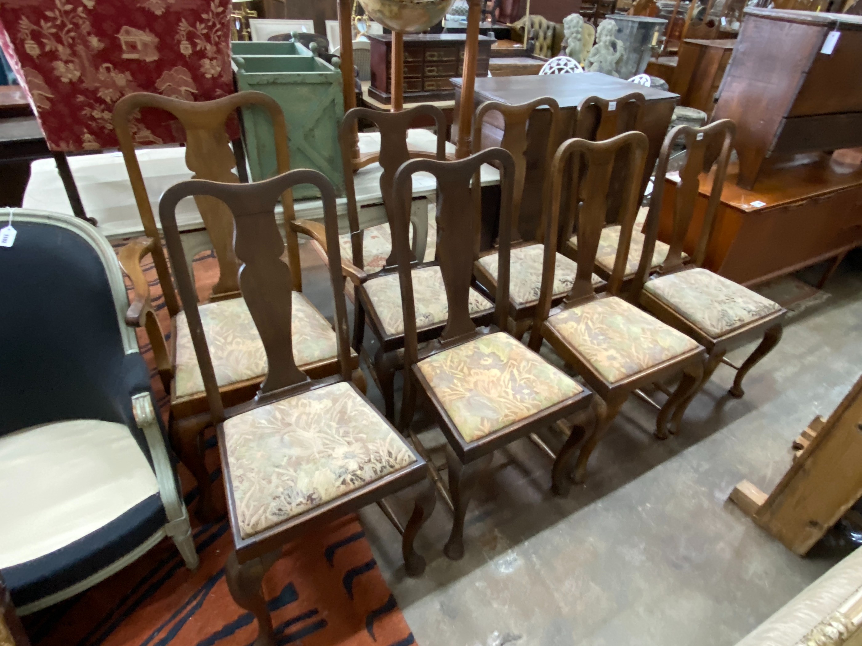 A set of eight early 20th century Queen Anne style mahogany dining chairs, one with arms